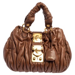 Miu Braune Matelas-Ledertasche Bauletto Aperto
