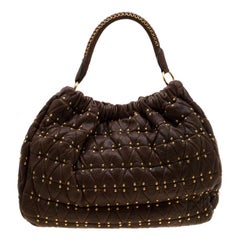 Borsa Miu Miu in pelle trapuntata marrone con borchie