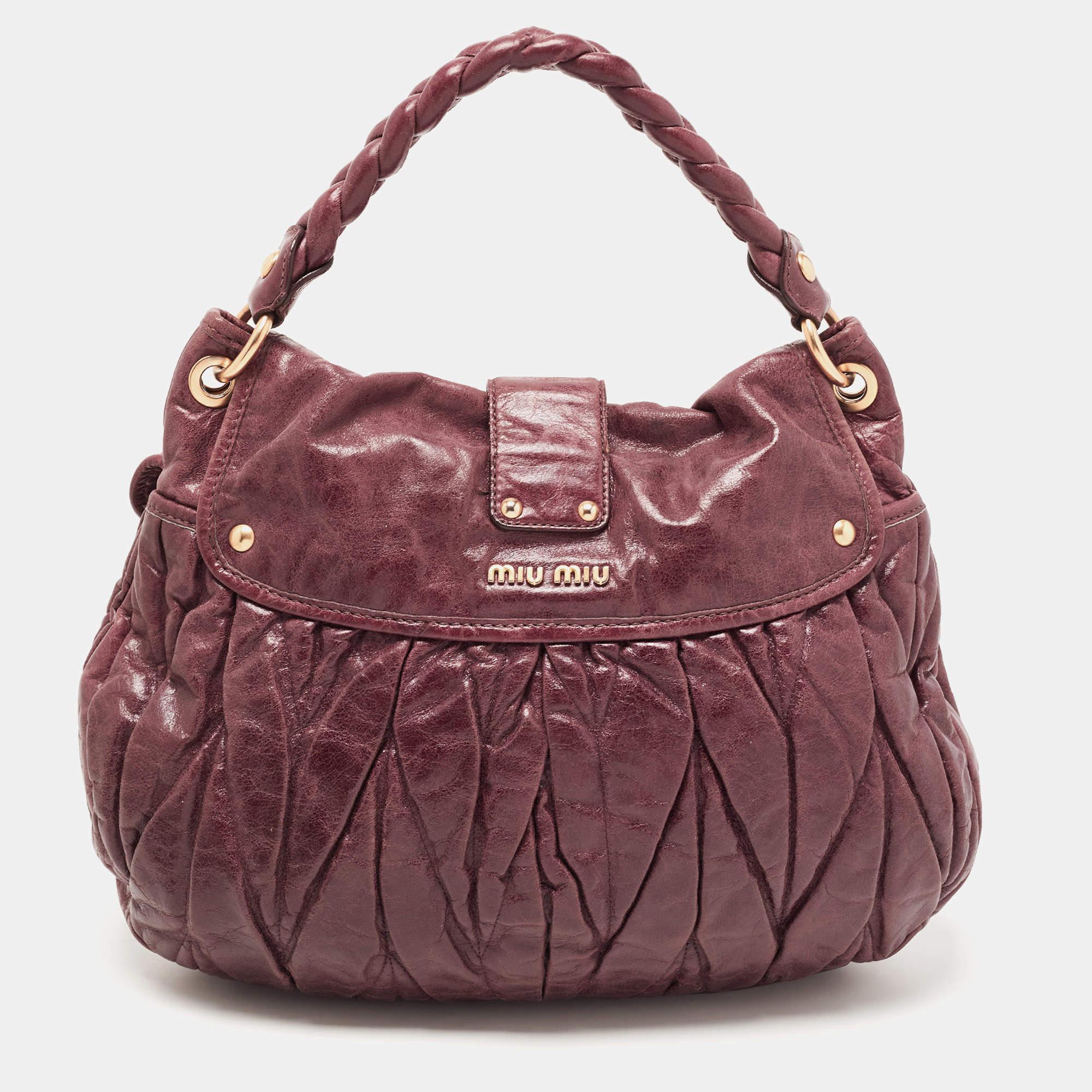 Marked by flawless craftsmanship and enduring appeal, this Miu Miu Coffer bag is bound to be a versatile and durable accessory. It has a spacious size.

Includes: key, Detachable Strap