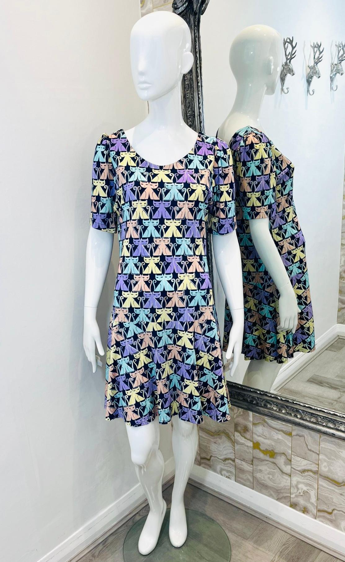 Miu Miu Cat Printed Dress

Black, short dress designed with multicoloured cat prints throughout.

Featuring round neckline and short puffed sleeves.

Styled with flared skirt vertical spaghetti strap embellishment to rear.

Size – XL

Condition –