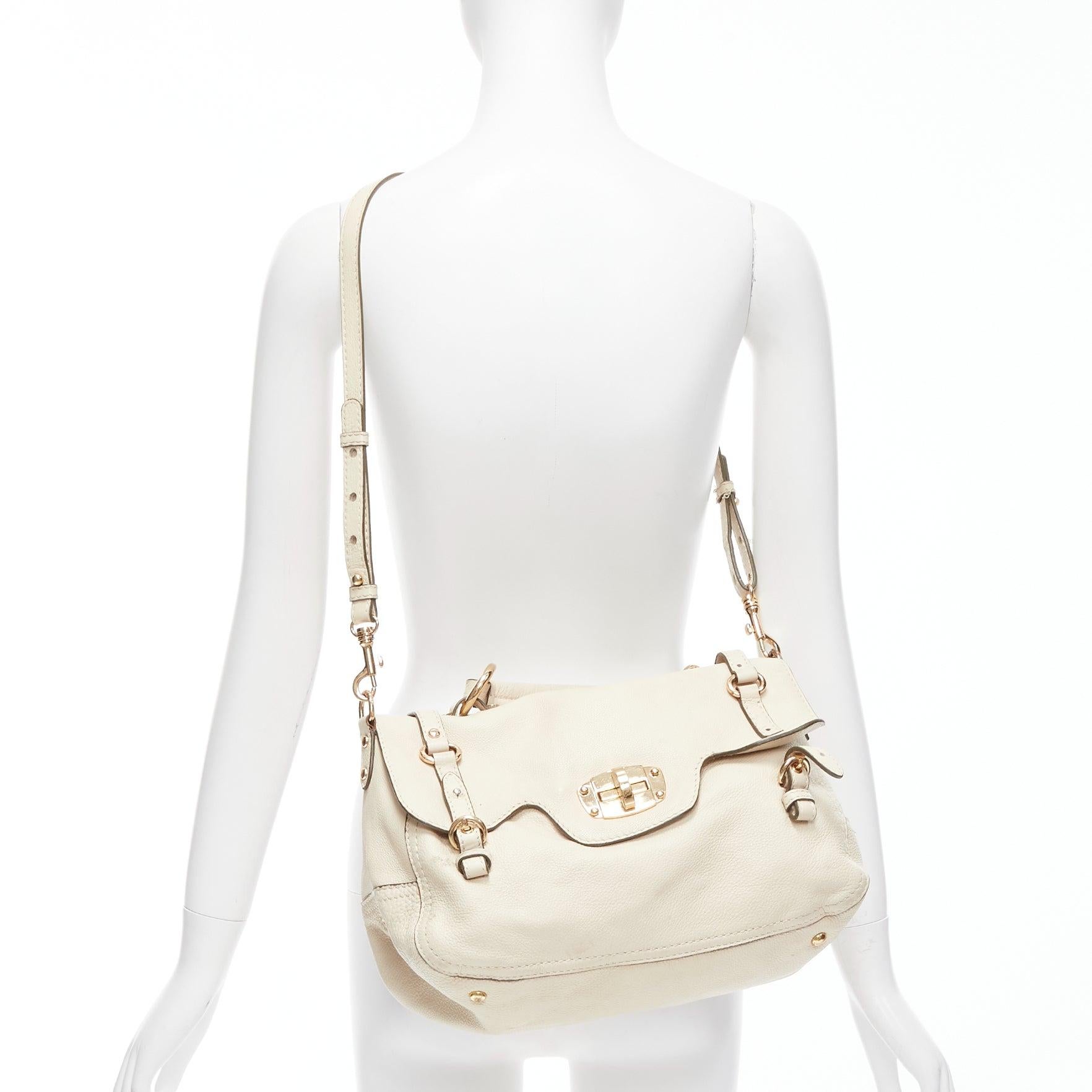 MIU MIU Cervo beige textured leather gold logo turnlock satchel bag
Reference: CNPG/A00043
Brand: Miu Miu
Designer: Miuccia Prada
Model: Cervo
Material: Leather
Color: Beige, Gold
Pattern: Solid
Closure: Turnlock
Lining: Brown Fabric
Extra Details: