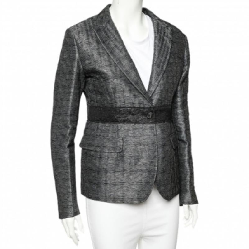 Sleek and comfortable, this blazer from Miu Miu will make others nod in admiration. The fabulous charcoal grey blazer is tailored from lurex silk, and it features front buttons, notched lapels, and pockets.