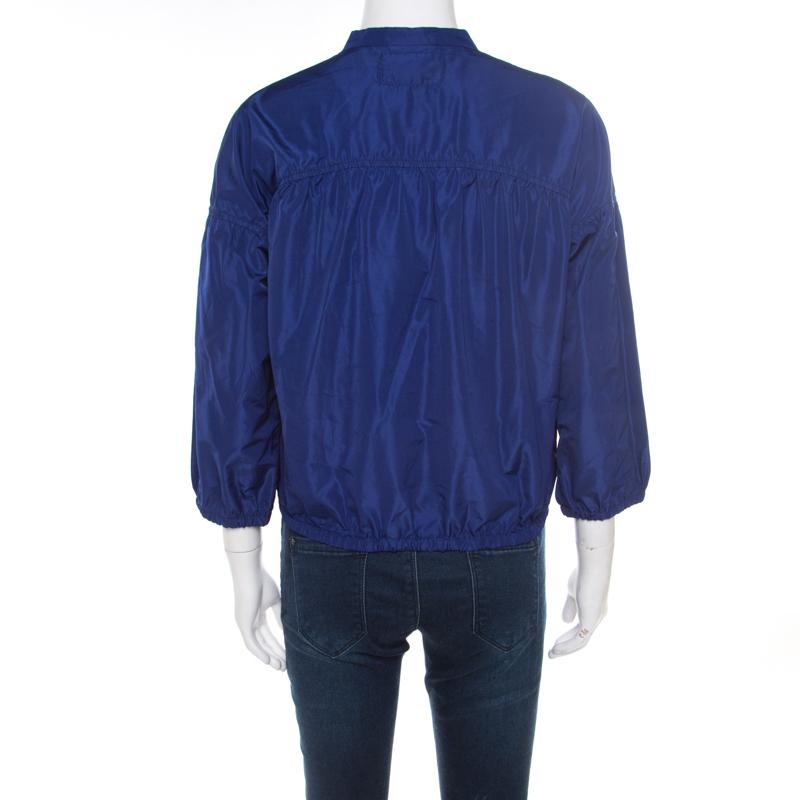 Making a stylish approach to casual fashion, you can add this jacket from Miu Miu. It is designed to be a windbreaker and features long sleeves and a full front zipper. This blue zipper will not just come in handy on windy days but also as a