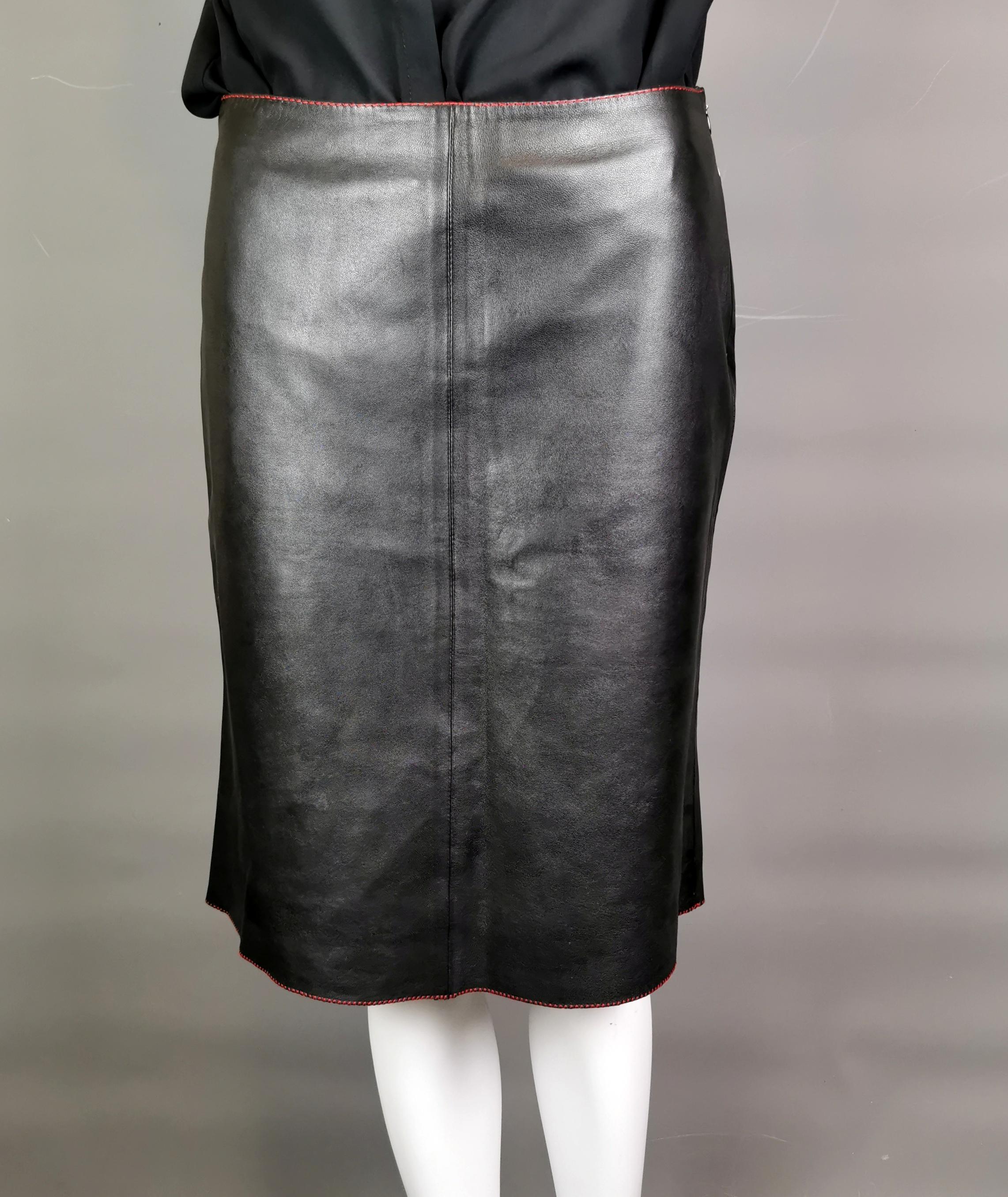 A good quality leather skirt is a true wardrobe staple.

This Miu Miu contrast leather midi skirt is a great choice!

It is a straight shape with a slight flare to the bottom, the skirt has lovely contrast red stitching and a cream leather band at