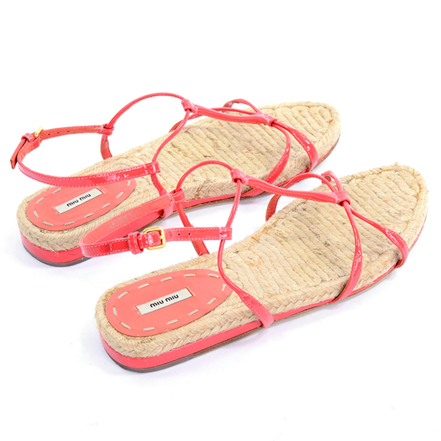 These are great coral Miu Miu sandals with and ankle strap and gladiator look! The T strap and ankle straps are all in a beautiful coral color. They have a woven straw insole similar to an espadrille and a leather sole with a rubber heel. Easy to