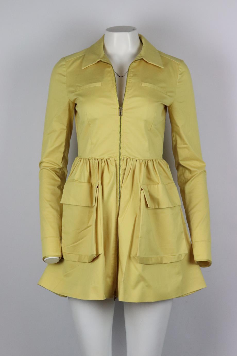 Miu Miu cotton blend mini dress. Yellow. Long sleeve, crewneck. Zip fastening at front. 95% Cotton, 5% elastane; lining: 50% acetate, 50% polyester. Size: IT 40 (UK 8, US 4, FR 36). Bust: 33.8 in. Waist: 27.8 in. Hips: 53 in. Length: 31.5 in. Very