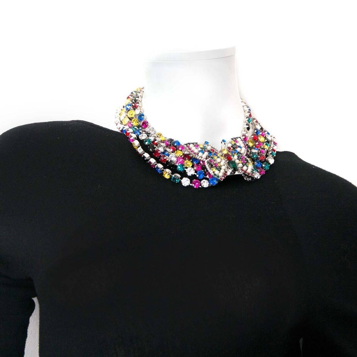 Excellent condition
Miu Miu Crystal & Faux Pearl Butterfly Collar Necklace

This silver-tone Miu Miu collar necklace features multiple rows of crystals in different colours and an eye-catching butterfly ornament.
The necklace closes with a push