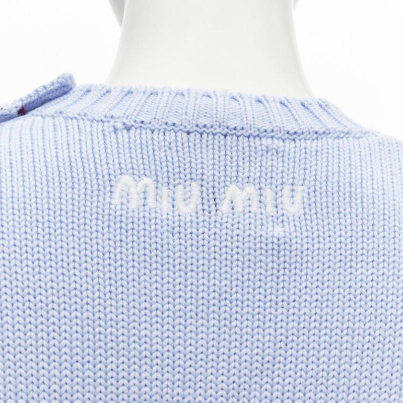 MIU MIU DISNEY Mickey Mouse powder blue red cropped sweater IT38 XS
Reference: AAWC/A00224
Brand: Miu Miu
Designer: Miuccia Prada
Collection: Disney
Material: Virgin Wool
Color: Blue, Red
Pattern: Disney
Closure: Button
Extra Details: Ribbed edges.