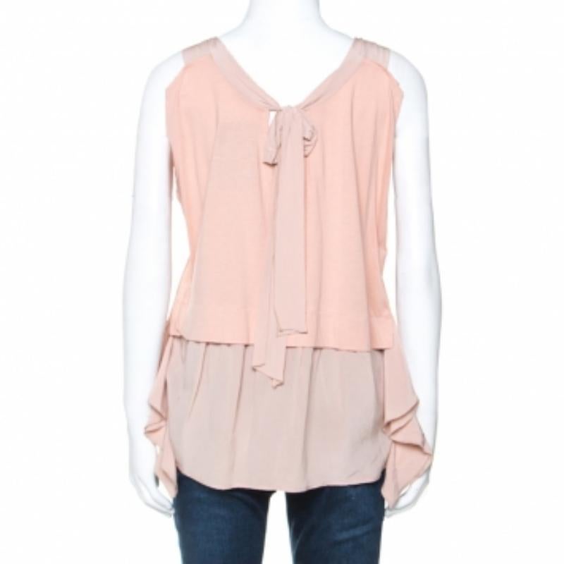 Turn heads when you wear this Miu Miu tunic that lends a sophisticated edge to your personality. Wear this dusky pink top with high waisted pants and pumps for a chic look. It carries an impressive silhouette with a sleeveless design and lovely