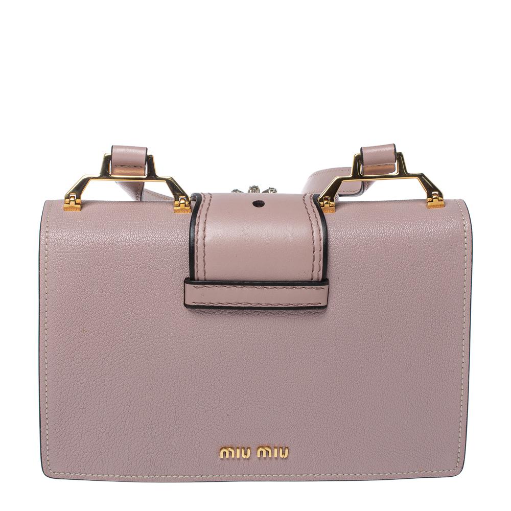 In an irresistible shade of dusty pink, this Miu Miu bag will transform your outfit into a combination of classic and contemporary. Made from Madras leather, its exterior is designed with a crystal-embellished buckle on the front flap and shoulder