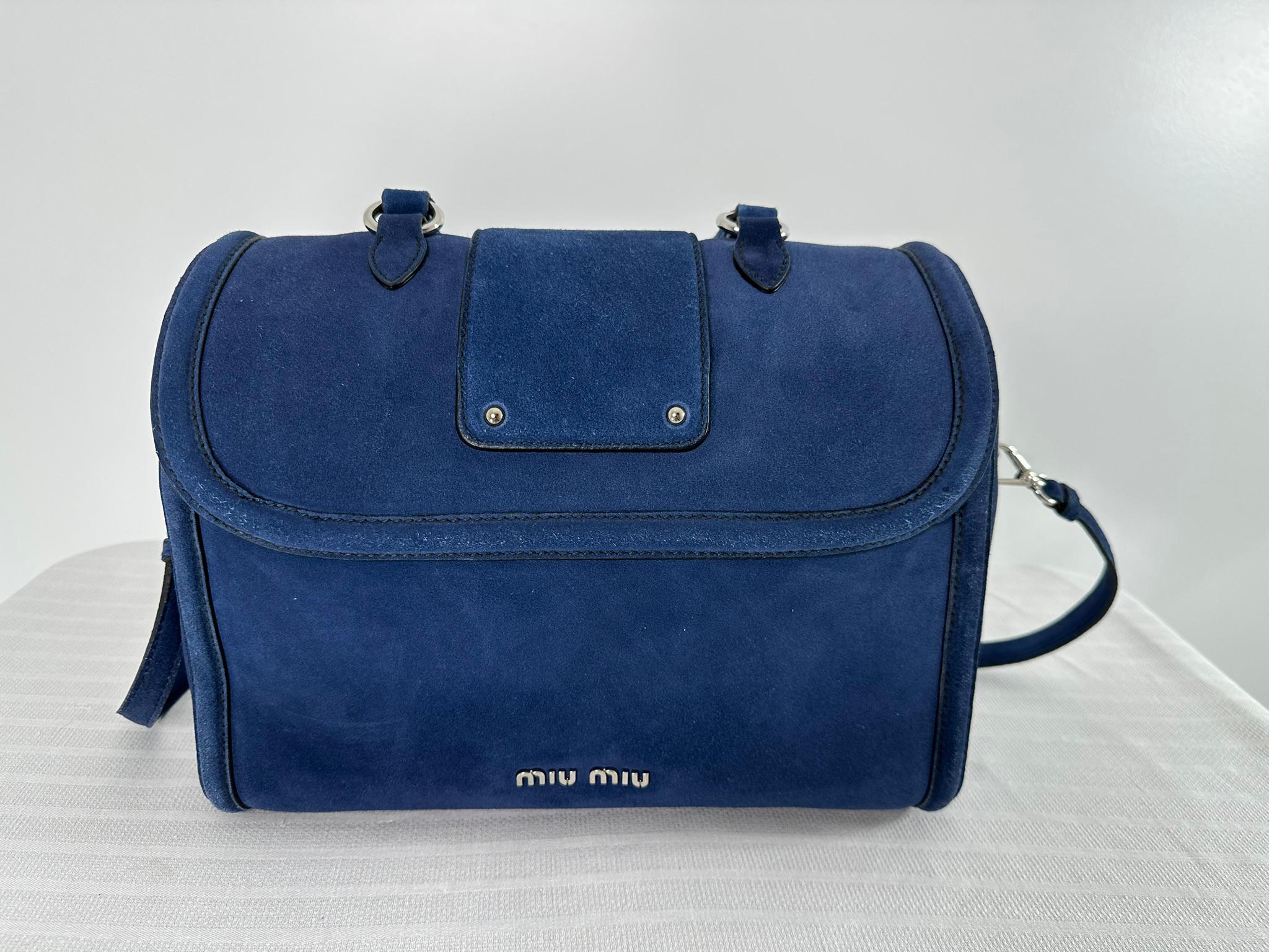 Miu Miu Fall 2012 look 23, runway in amber suede.  This bag in bright blue suede, 2 way structured, handle/shoulder bag. Beautiful bright blue suede bag can be carried by the handle or with the removable shoulder strap. Bright silver hardware, the