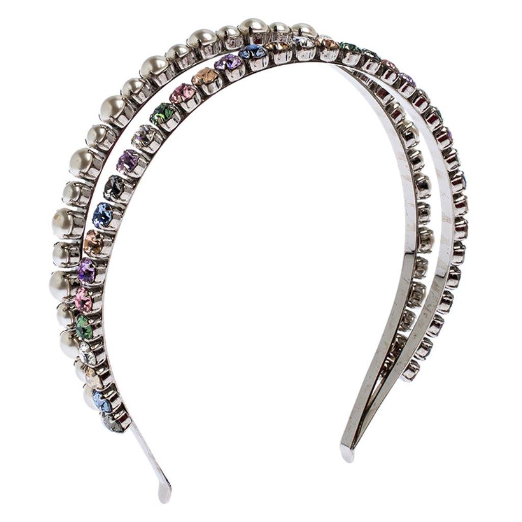 This charming and delicately designed headband by Miu Miu is a must have! Designed with faux pearls and multicolor crystals, this silver-tone band has a shiny finish. Wear this with your summer casuals or floral dresses and add a dash of sparkle to