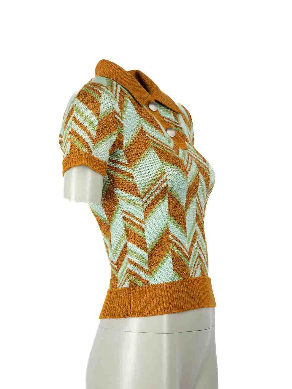 CONDITION is Very good. Minimal wear to top is evident. Minimal tarnishing to the top snap button on this used Miu Miu designer resale item.

Details
Multicolour
Wool
Knit top
Geometric pattern
Short sleeves
Round neck
Snap button fastening
Metallic