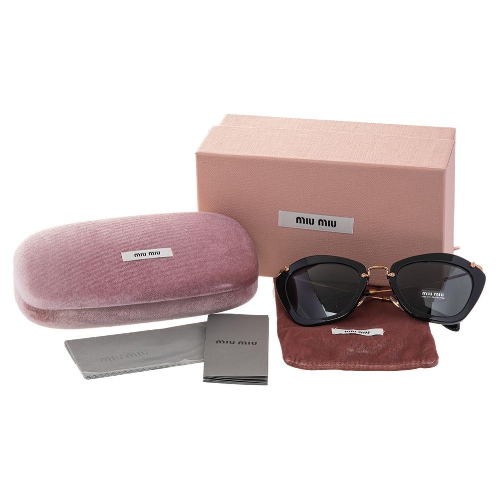 Quality lenses are set in a stylish cat-eye frame to bring out the beauty of this pair of SMU 10N sunglasses by Miu Miu. The modern chic design will continually offer a statement finish on any day.

