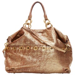 MIU MIU gold coated pebble leather grommet studded top zip shoulder satchel bag