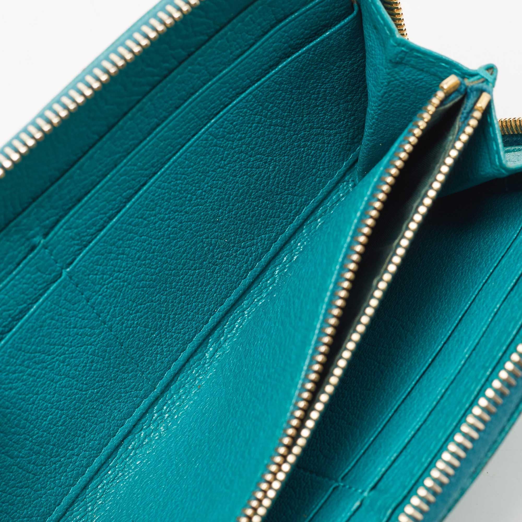 This Miu Miu leather zip around wallet is perfect to be carried solo or inside your tote while you step out to run errands. It is a durable accessory.