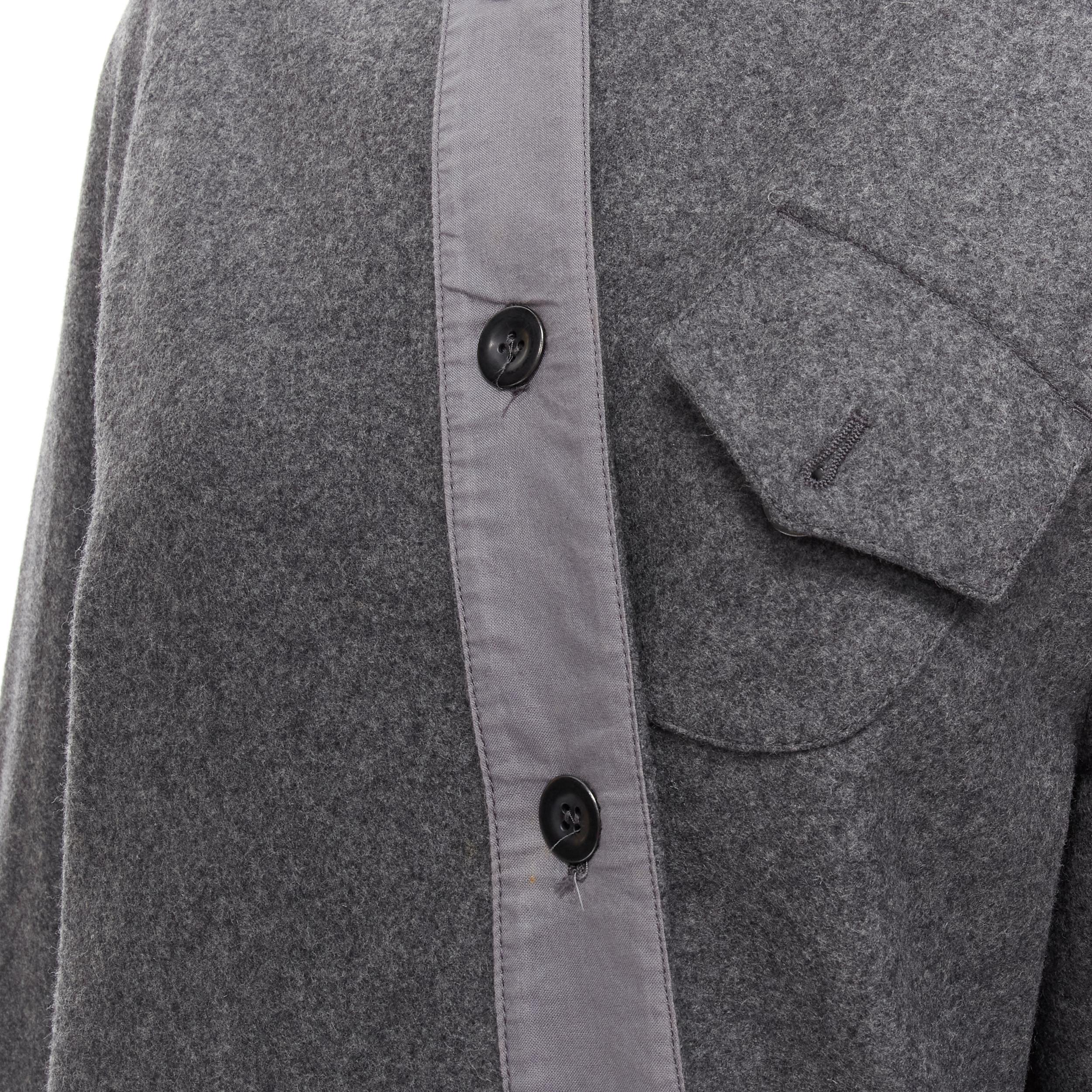 MIU MIU grey cashmere wool blend asymmetric button boxy coat IT38 XS 
Reference: CELG/A00157 
Brand: Miu Miu 
Designer: Miuccia Prada 
Material: Wool 
Color: Grey 
Pattern: Solid 
Closure: Button 
Extra Detail: Missing detachable fur collar. Curved