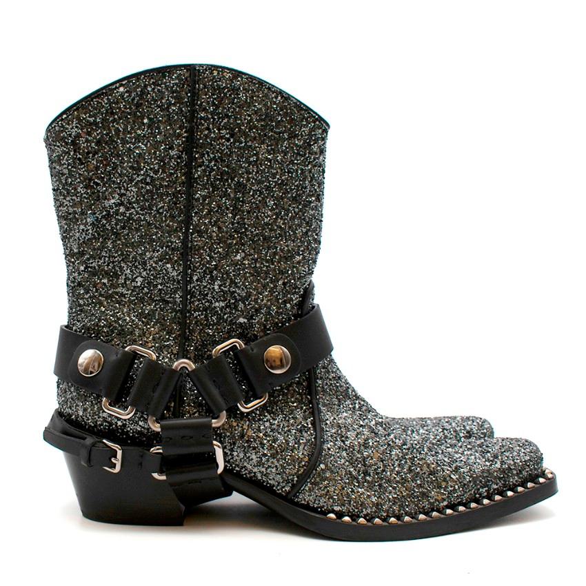 Miu Miu Grey Glitter Cowboy Boots 

- All-over glitter design
- Cowboy shape
- Pointed toe
- Block heel
- Ankle straps with silver-tone hardware

Materials:
Outer Composition: 
- 100% Leather
Sole Composition: 
- 100% Rubber
Outer Composition: 
-