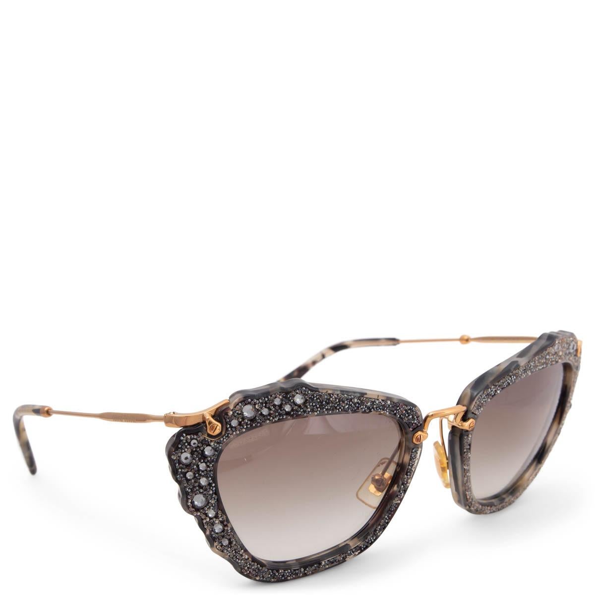 100% authentic Miu Miu SMU04Q cat-eye sunglasses in grey, black and cream tortoise acetate embellished with glitter and rhinestones with grey gradient lenses and gold-tone metal temples. Have been worn and are in excellent condition. Come with case.