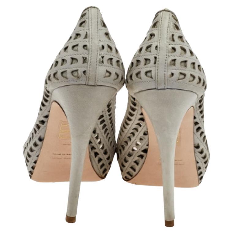 With grey laser-cut leather used to make their sturdy exterior and pointy heels added to define them, these platform pumps exude elegance and charm equally. Whether you wear these for a casual event or formal use, you will surely fetch admiration