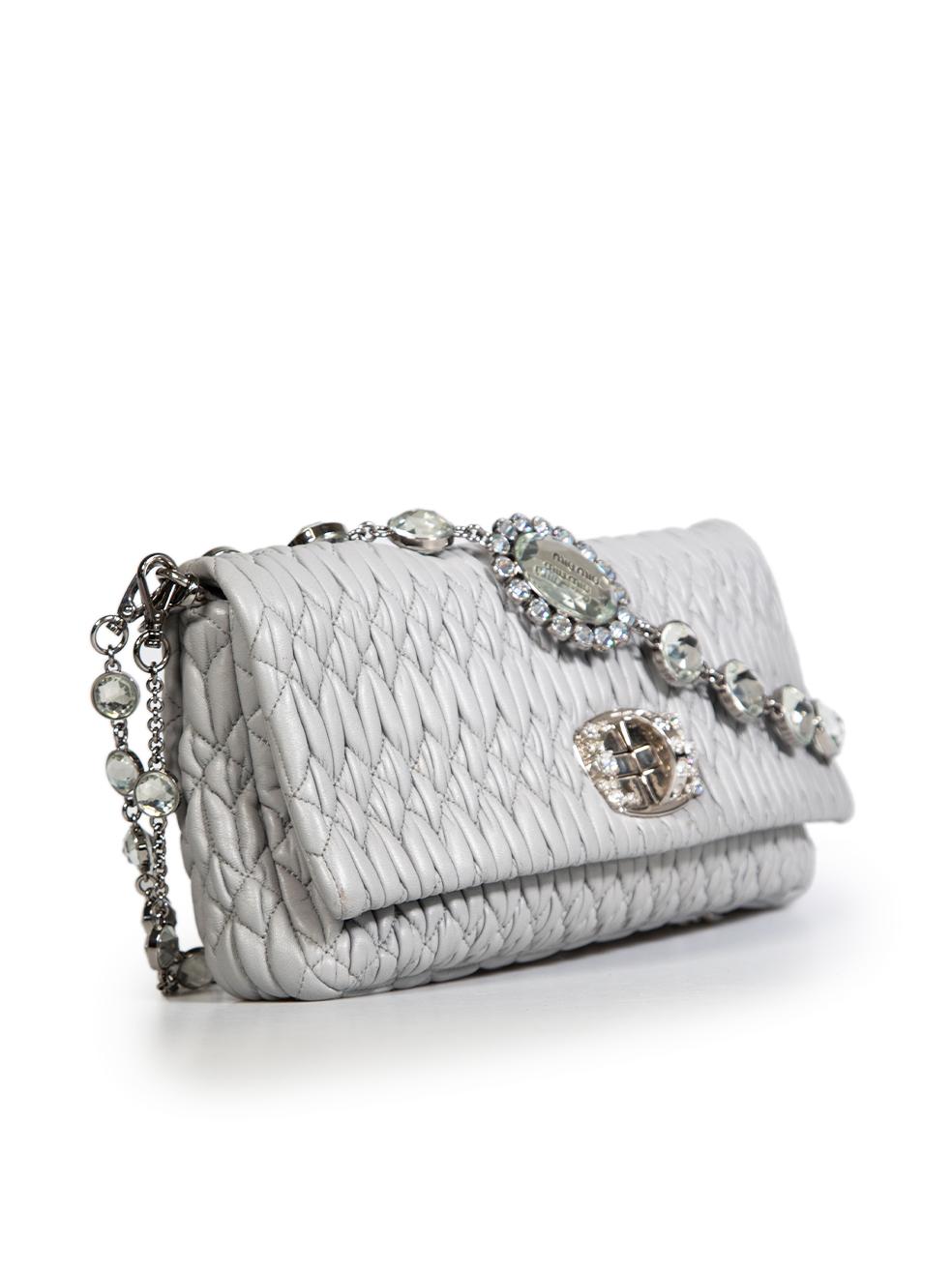 CONDITION is Very good. Minimal wear to bag is evident. Minimal wear to clasp hardware with scratches on this used Miu Miu designer resale item. The item comes with its original dust bag.
 
 
 
 Details
 
 
 Grey
 
 Leather
 
 Medium shoulder bag
 
