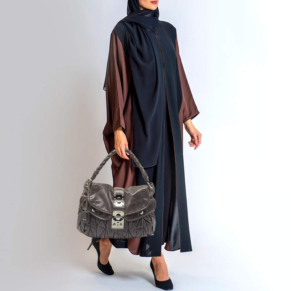 Ensure your day's essentials are in order and your outfit is complete with this Miu Miu Coffer bag. Crafted using the best leather, the bag carries the maison's signature of artful craftsmanship and enduring appeal.