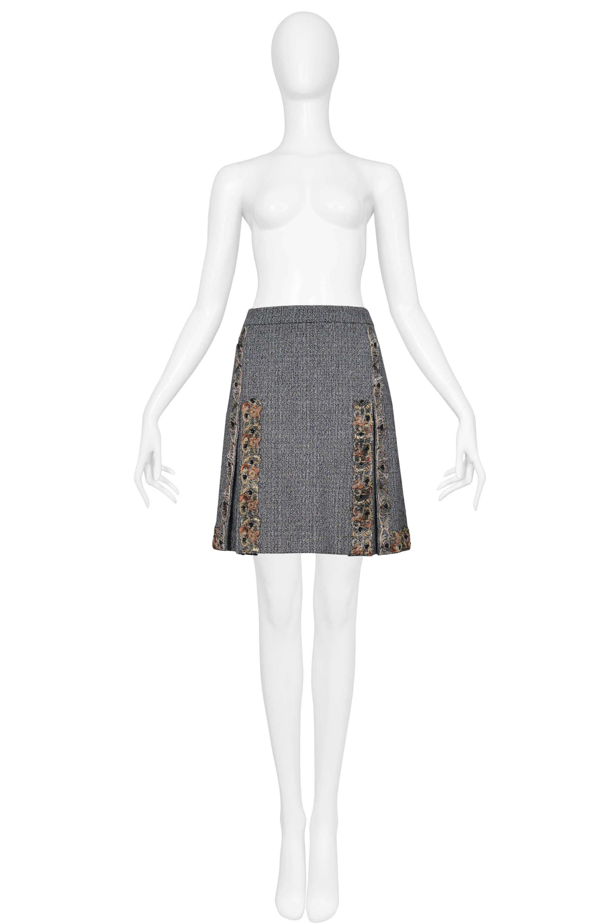 Resurrection Vintage is excited to offer a vintage Miu Miu grey tweed wool skirt featuring box pleats and decorative trim. 

Miu Miu
Size 44
Wool
2004 Collection 
Excellent Vintage Condition
Authenticity Guaranteed 