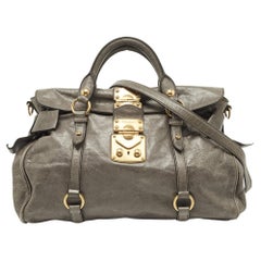 Miu Vitello Lux - Sac en cuir gris avec nœud latéral