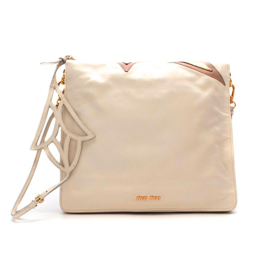 Miu Miu Ivory/Gold Star Pattern Crossbody Bag 

- Appliqued star pattern
- Gold metallic finishes
- Cut out detail on strap 
- Slip pocket in the front divide 
- Zip pocket in the back divide 

Materials:
- Leather blend

THERE IS NO CARE LABEL