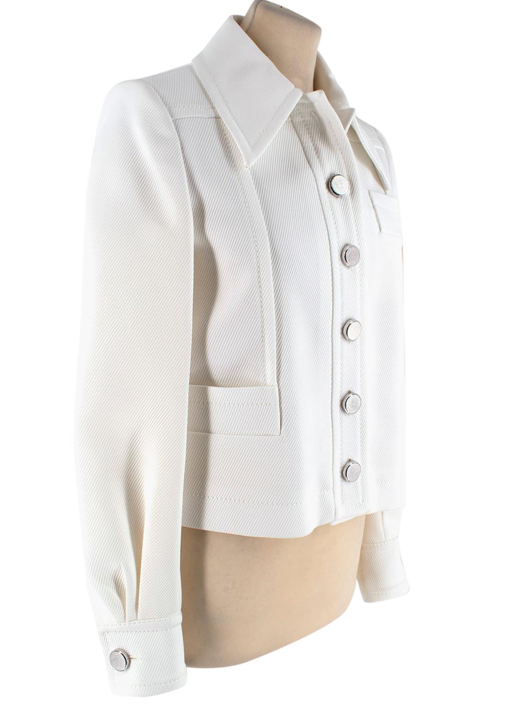 Miu Miu Ivory Jacket with Silver Buttons

-Minimal classic design  
-Luxurious metal buttons with a striped texture 
-Amazing soft fabric with a stripes texture 
-3 funcional outer pockets 
-buttoned cuffs with pleats 
-Top stitching details