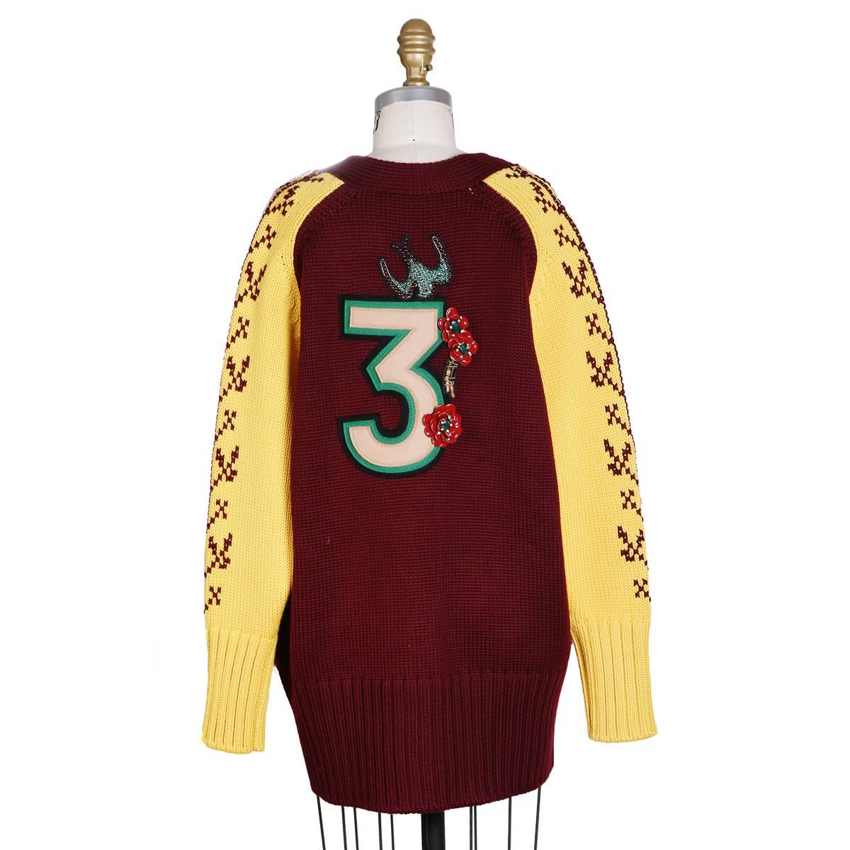 Sweater by Miu Miu
Features ornate back patches
Virgin wool
Condition: Excellent

Size/Measurements:
Size 38
46