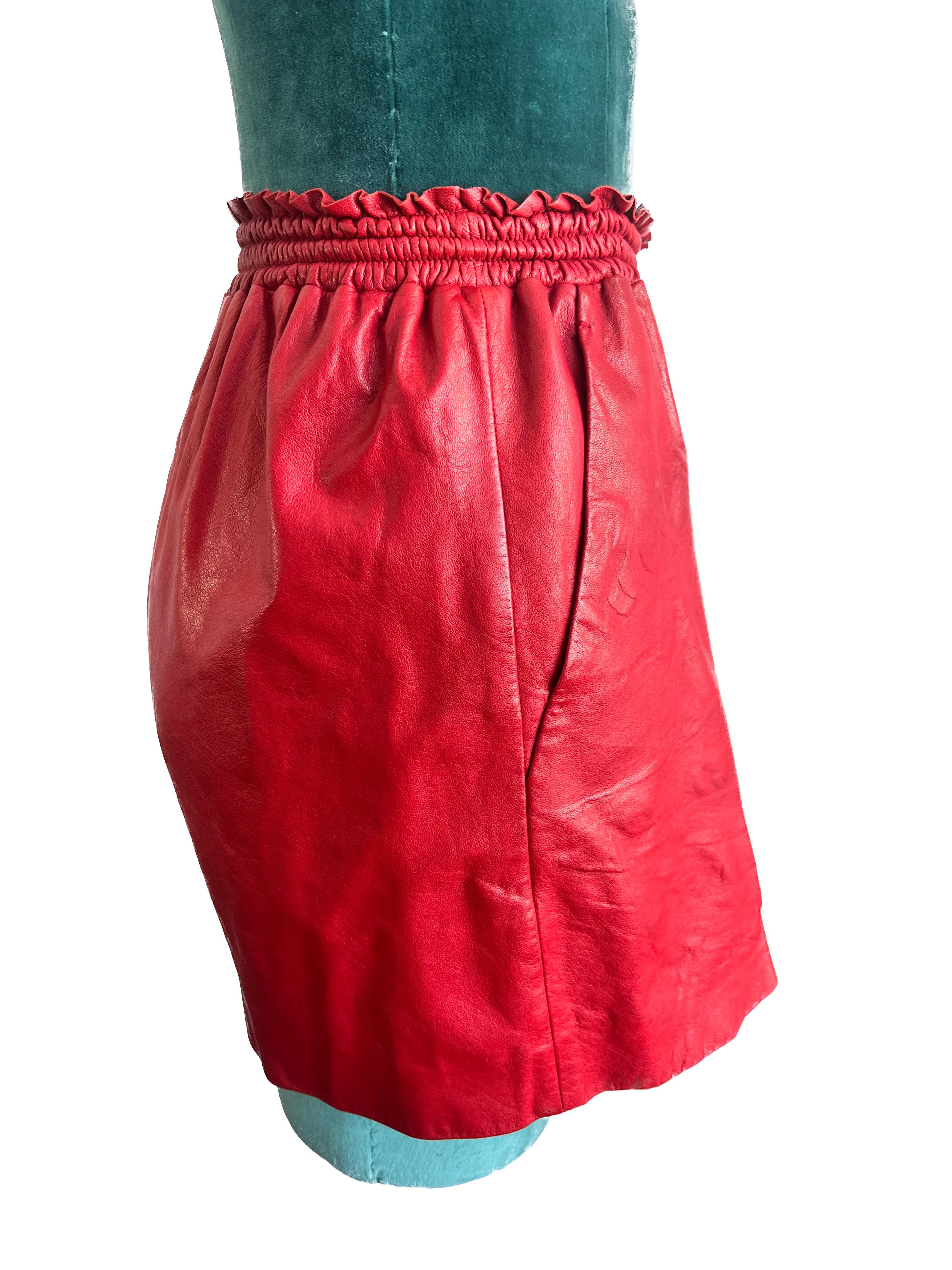 
Elevate your style quotient to new heights with the Miu Miu red lamb skin leather shorts, a testament to the art of luxurious dressing. Impeccably crafted from the finest lamb leather, these shorts offer an unparalleled level of softness that is