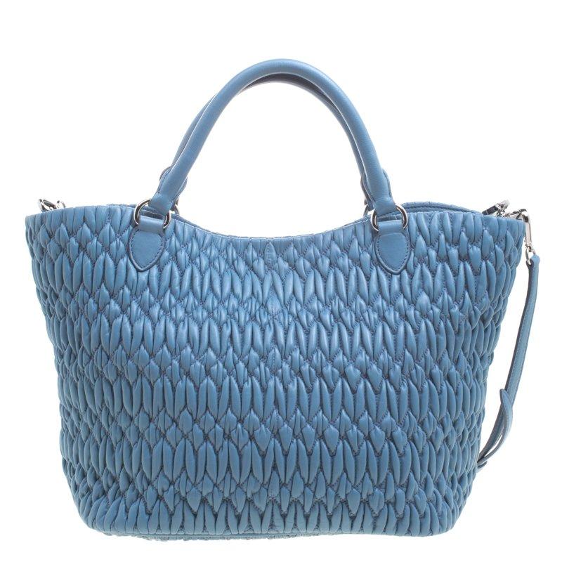 Now here's a bag that is both stylish and functional! Miu Miu brings us this gorgeous bag that has been crafted from leather and designed using the Matelasse technique. It has a dreamy light blue hue, a spacious satin interior capable of carrying