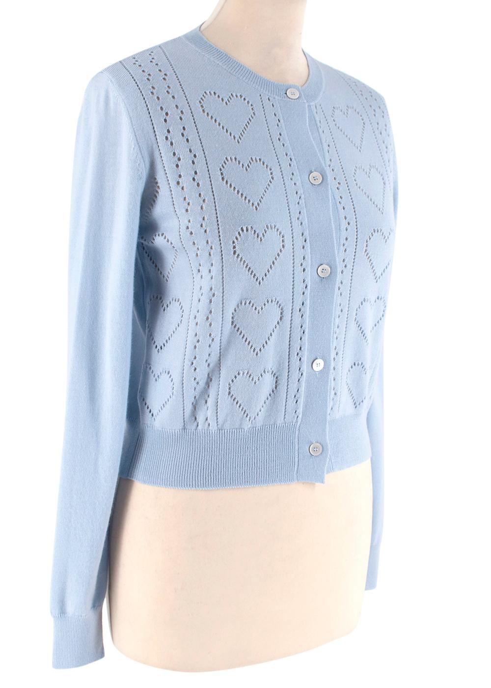 Miu Miu Pointelle-knit Heart Baby Blue Cardigan

- Knitted heart design on the bodice of the cardigan
- Buttoned fastening with thin pearl buttons 
- Ribbed hemlines around the round neckline and cuffs
- Light weight material
- Long sleeves
- Warm