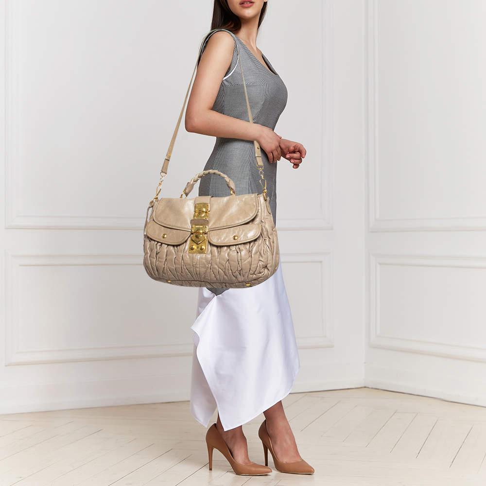 This chic and feminine Coffer hobo is from Miu Miu. The bag is crafted from leather carrying the signature matelassé pattern and features a flap that opens up to a fabric lined interior sized to fit your daily essentials. The hobo is equipped with a