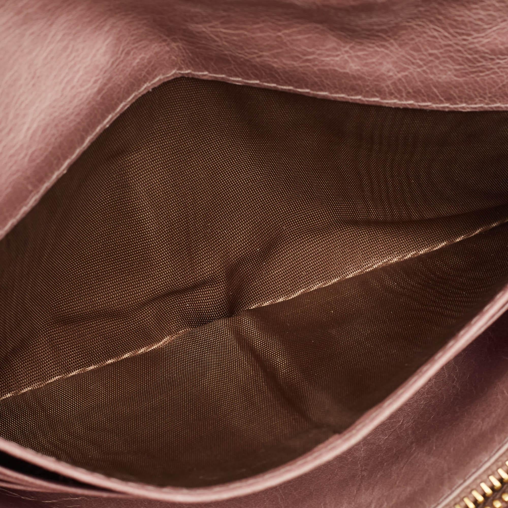 A beautiful wallet for stylish women, this Miu Miu wallet is perfect to be carried solo or inside your tote while you step out to run errands. It is a durable accessory.