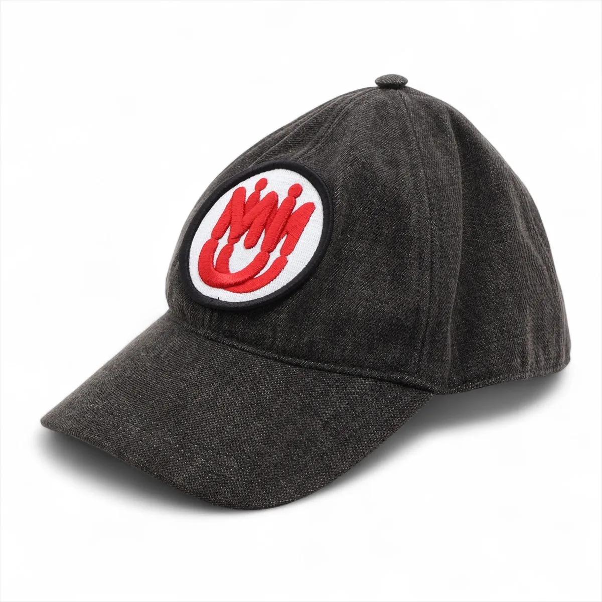 The Miu Miu Logo Cap in Cotton Black is a casual yet stylish accessory that combines comfort with contemporary design. Crafted from soft cotton, it features a classic curved brim. The front is highlighted with a bold round red and white Miu Miu