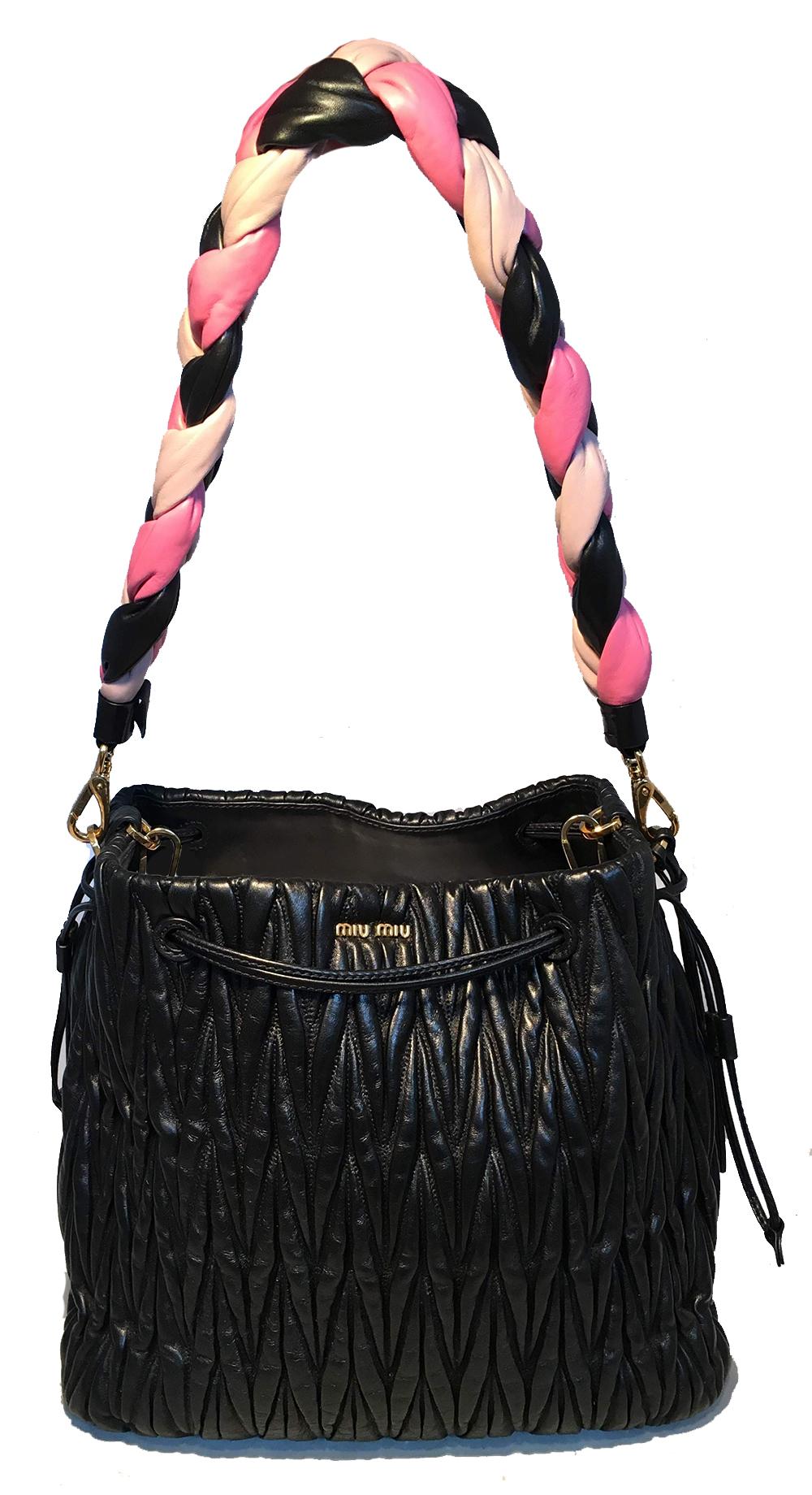 Miu Miu Matelassé Secchiello Black Leather Bucket Bag with Pink Braided Strap in excellent condition. Black nappa leather exterior in signature matelasse quilting. Gold hardware trim. Unique top soft drawstring style closure. Can be left open as see