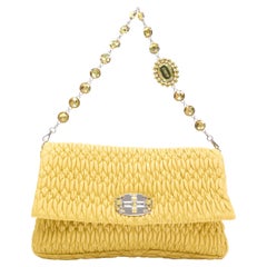 MIU MIU Matelasse yellow leather crystal rhinestone chain turn lock clutch bag