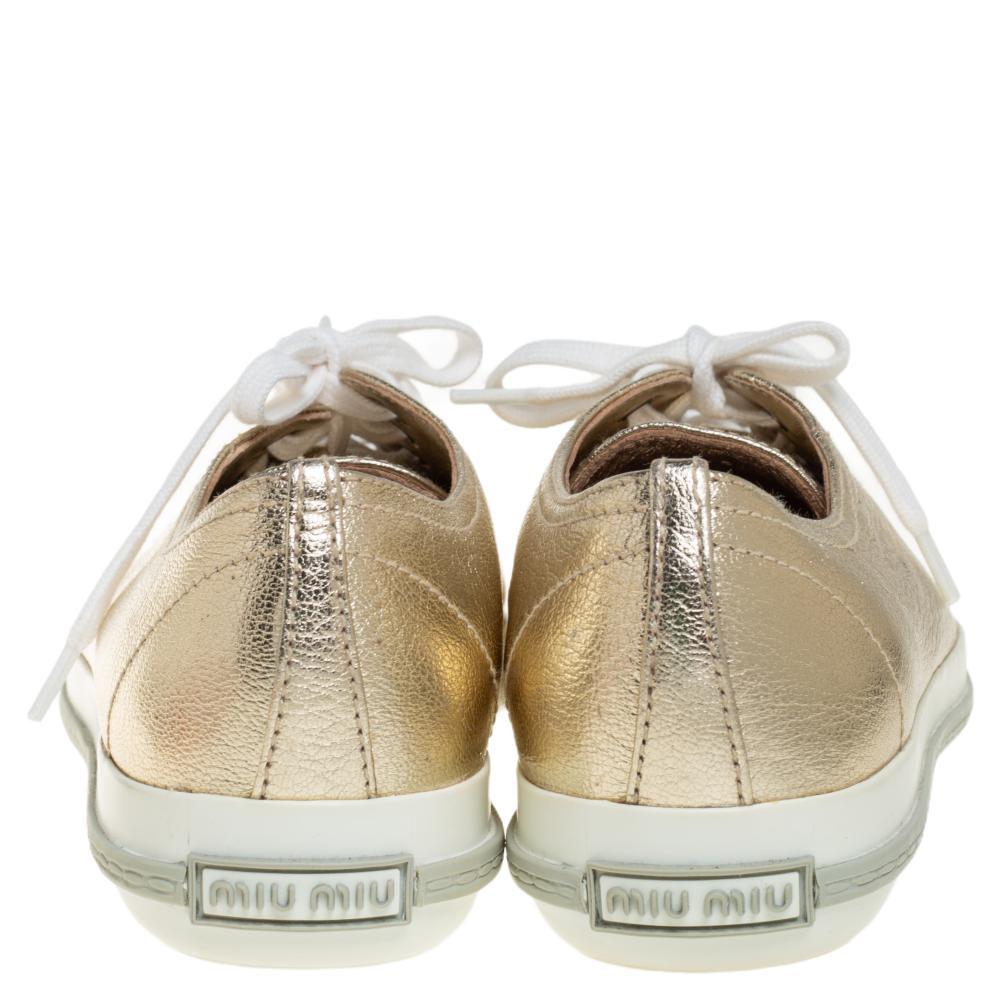 A signature Miu Miu style, these low-top sneakers for women are crafted in leather and detailed with crystals on the cap toes. They are secured with lace-ups and set on durable rubber soles.

Includes: Original Dustbag