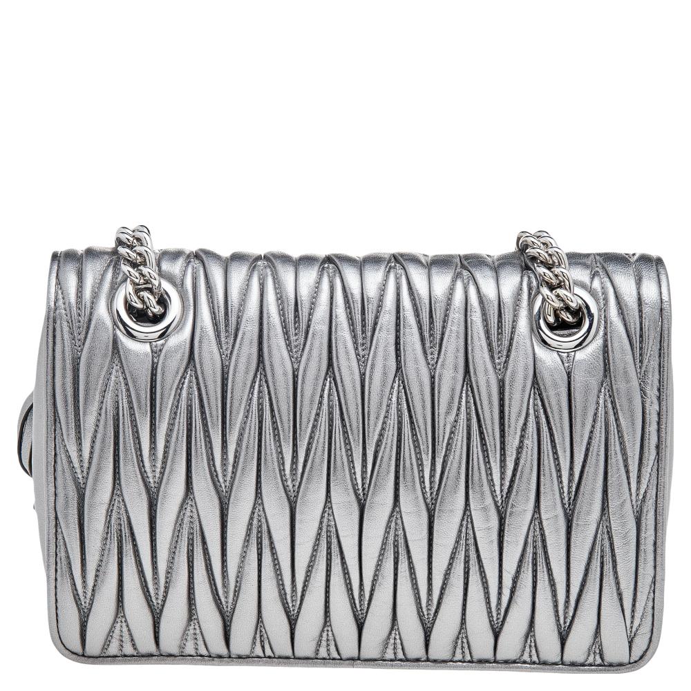 Now here's a bag that is both stylish and functional! The House of Miu Miu brings us this gorgeous Club shoulder bag that will make you look glamorous! It is made from metallic silver Matelasse leather and features a silver-tone logo accent on the