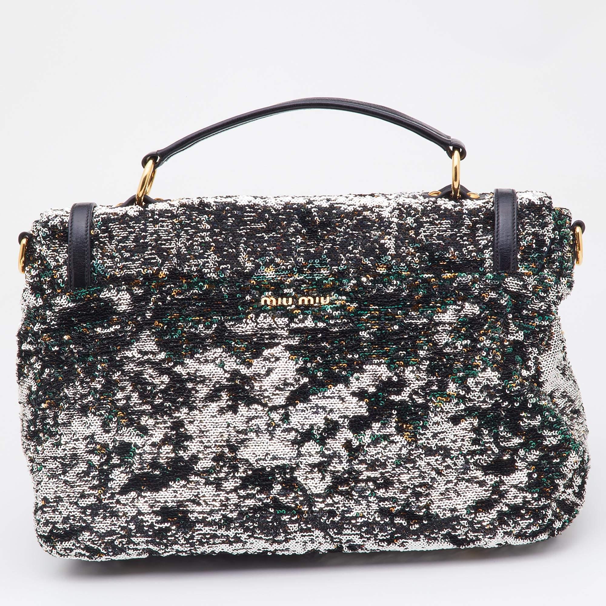 A lovely silhouette and gorgeous details make this bag from Miu Miu a covetable piece that you must splurge on! It is decorated with sequins all over the exterior and has a logo-detailed lock on the front flap. The bag opens to a spacious,