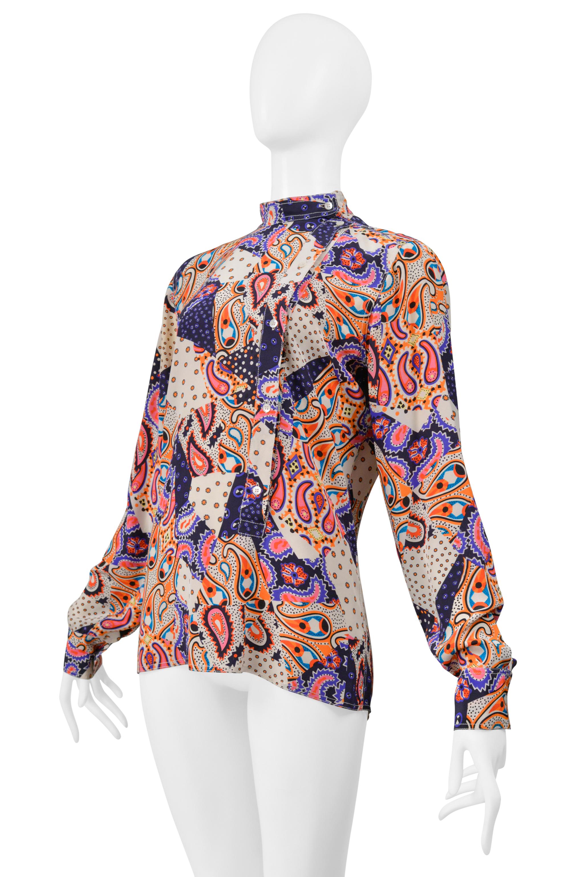 Resurrection Vintage is excited to offer a vintage Miu Miu paisley print blouse featuring a multicolor print throughout, mock neck, off-center front buttoning, button cuffs, and a straight hem. 

Miu Miu
Fabric Label Faded:  Feels Like Silk
Size