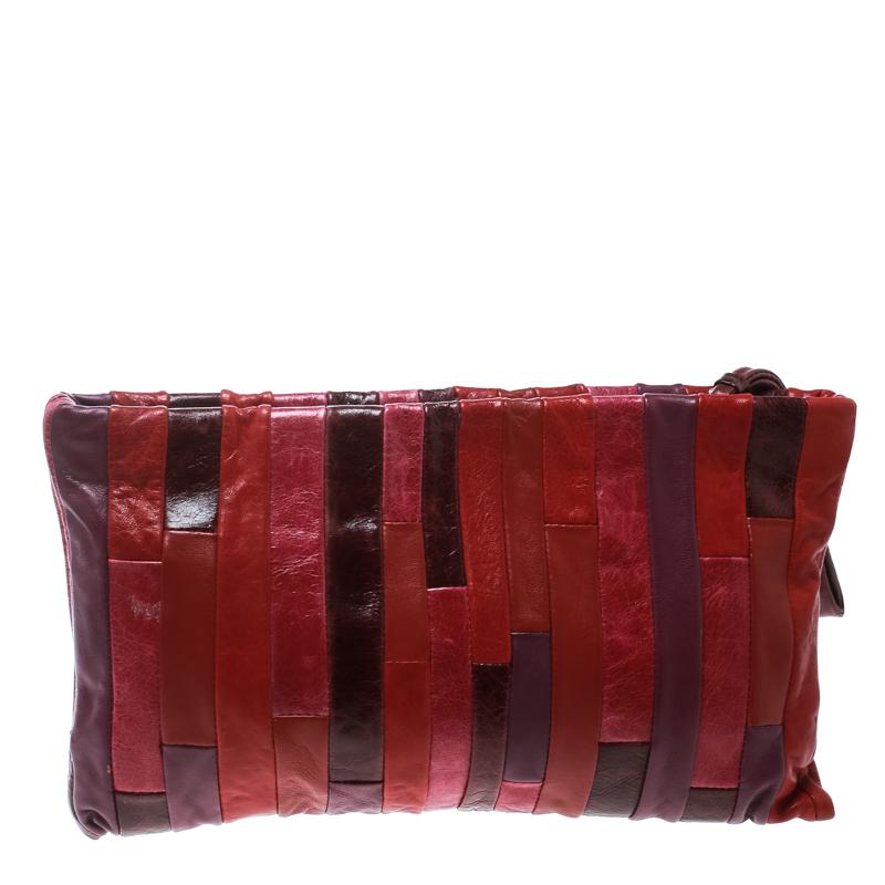 Made using patches of Nappa leather, this clutch from Miu Miu is a creation worthy of being yours. It features multiple colors, one main satin interior, and a wristlet. The clutch is well-made and handy.

