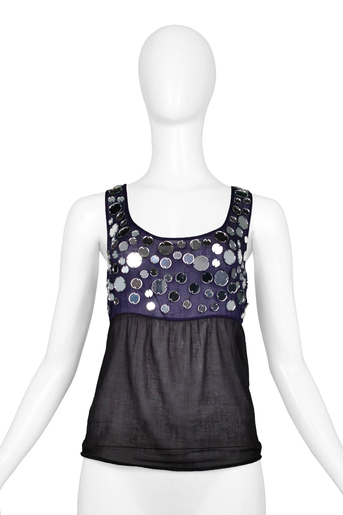 Resurrection Vintage is excited to offer an iconic Miu Miu sheer tank top featuring black & navy color blocking, multi-sized mirror detailing, and a scoop neck.

Miu Miu
Size: 42
100% Cotton
Excellent Vintage Condition
Authenticity guaranteed