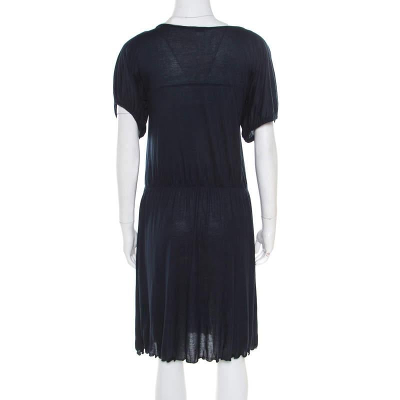 With such a chic and stylish dress, you are sure to make a statement! The navy blue Miu Miu creation is made of a cotton blend and features a gathered silhouette. It flaunts a boat neckline and short sleeves. It is sure to look fabulous on you and