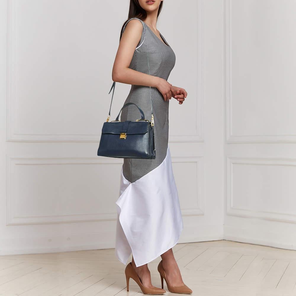 Exuding unparalleled elegance and sophistication  this bag is made from the finest material in a gorgeous hue. While the roomy interior offers ample space  the top handle allows you to carry it with much elegance.