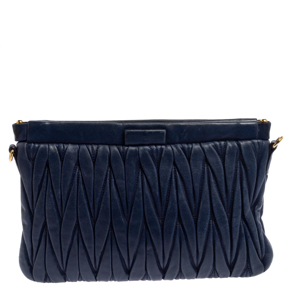Now here's a bag that is both stylish and functional! Miu Miu brings us this gorgeous clutch that has been crafted from navy blue leather and designed using the Matelasse technique. It has a lovely fabric interior capable of carrying your