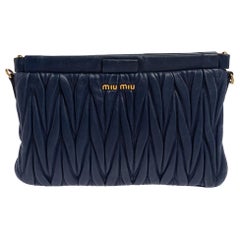 Used Miu Miu Navy Blue Matelasse Leather Frame Clutch Bag