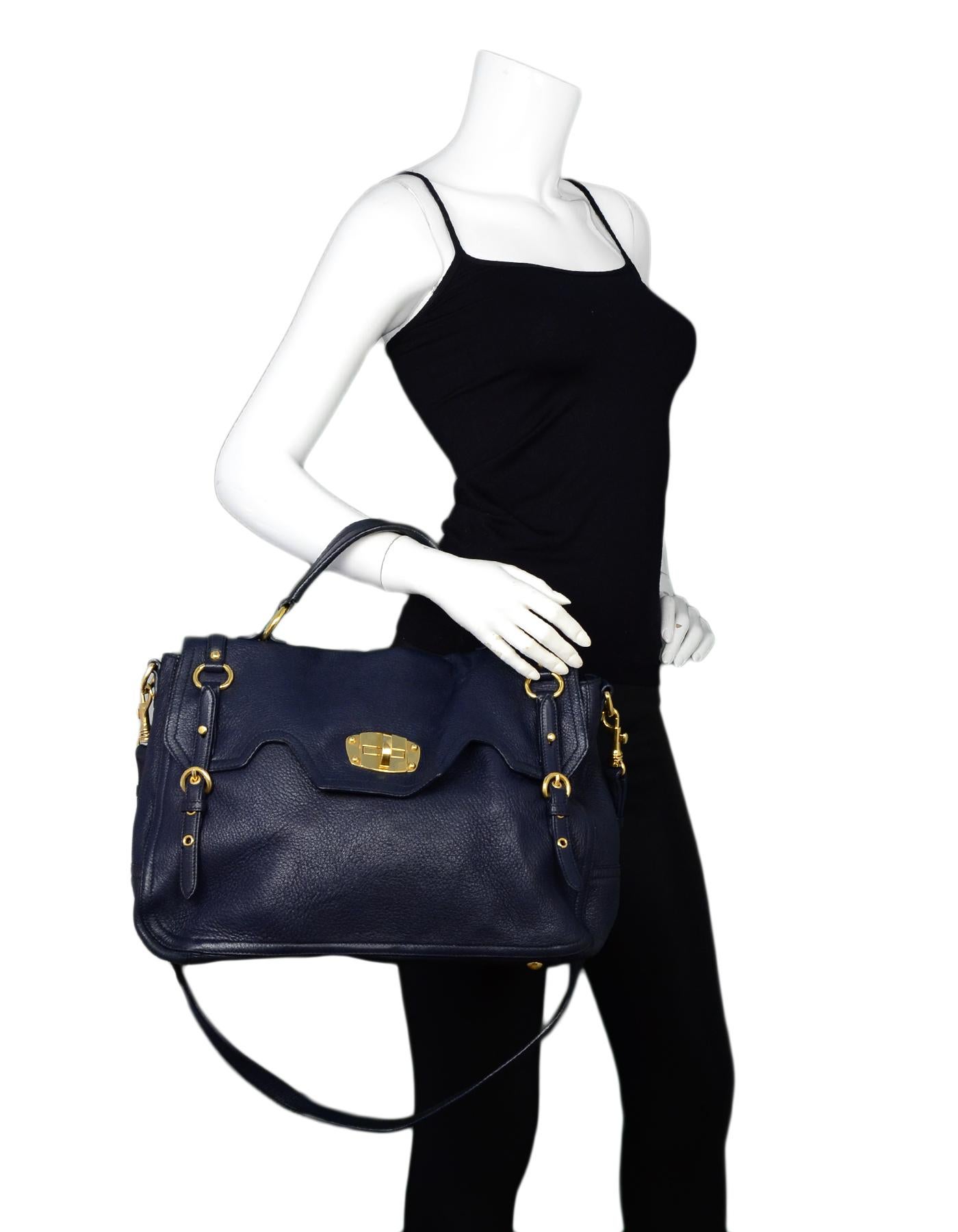 Miu Miu Navy Cervo Leather Large East/West Patina Buckle Satchel Messenger Bag

Made In: Turkey
Color: Blue
Hardware: Goldtone hardware
Materials: Cervo leather
Lining: Beige suede lining
Closure/Opening: Top flap with buckles and central